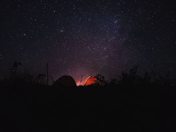 Beautiful campsite with a starry sky and campfire 