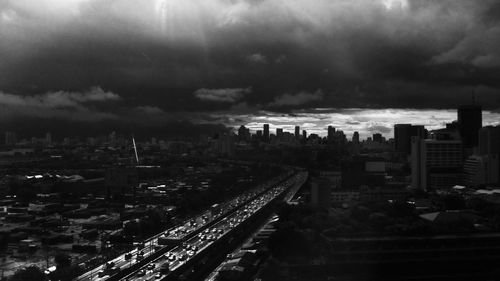 Cityscape against cloudy sky