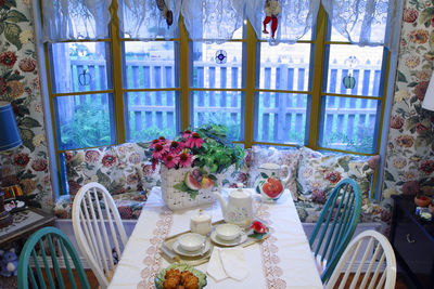 Potted plants on table by window