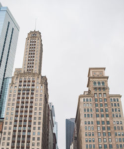 Low angle view of buildings against sky in city