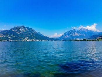 Scenic view of lake against blue sky