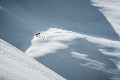 Person skiing on snowcapped mountain