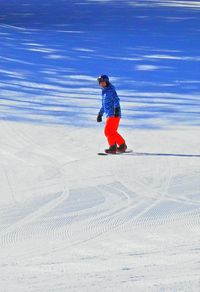 Full length of man skiing on snow