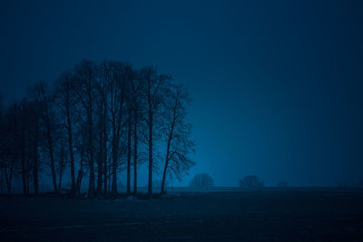 A dark morning of late autumn in northern europe rural areas. fall scenery with dark skies.