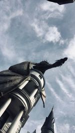 Low angle view of statue against sky