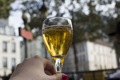 Close-up of hand holding wineglass