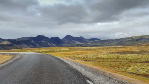 Road amidst landscape against sky