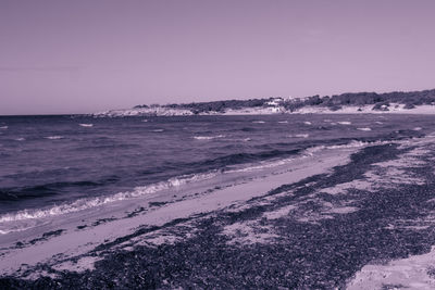 Scenic view of beach against clear sky