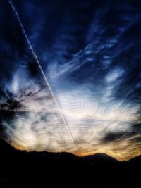 Low angle view of vapor trails in sky