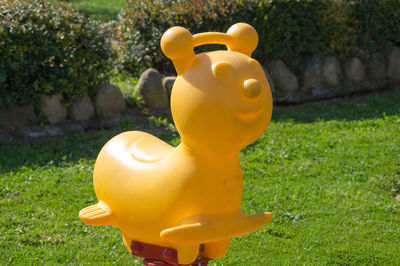 Close-up of yellow toy in park