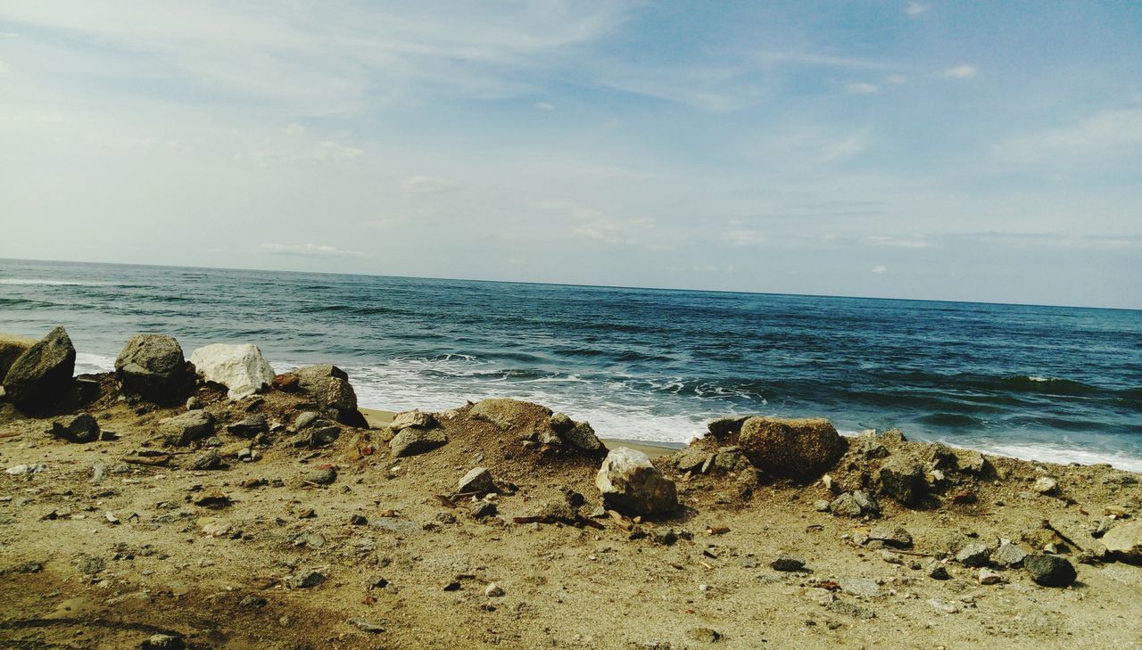 sea, horizon over water, sky, nature, beauty in nature, water, scenics, tranquility, tranquil scene, no people, beach, rock - object, cloud - sky, day, outdoors, scenery