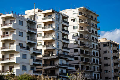 Buildings in city against sky