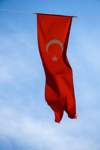 Low angle view of flag against sky