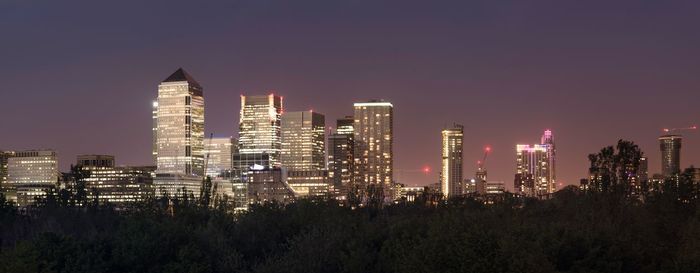 View of skyscrapers lit up at night