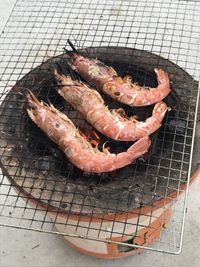 High angle view of meat on barbecue grill