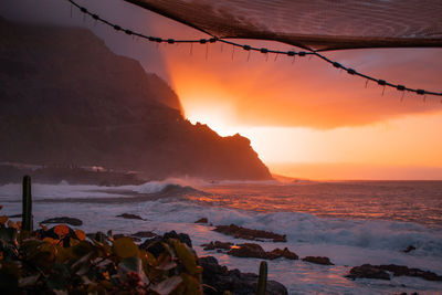 Scenic view of sea against sky during sunset