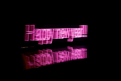 Digital composite image of illuminated light against black background