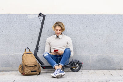 Portrait of young man sitting outdoors