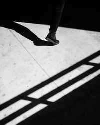 Low section of people walking on road