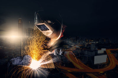 Light painting on illuminated building in city