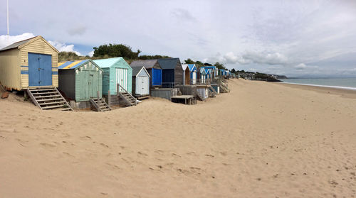 Beach huts against sky