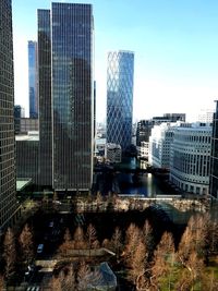 Modern buildings in city against sky