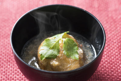 Close up of green soup in bowl