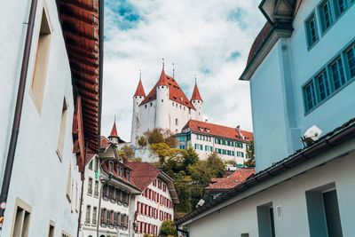 Low angle view of buildings against sky in city