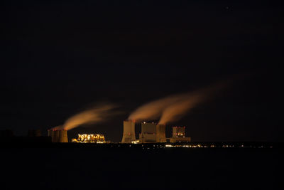 Illuminated buildings in city at night