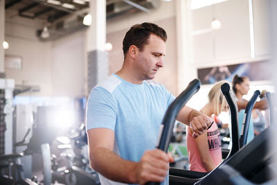 Man checking time at gym