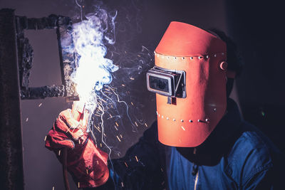 Close-up of man welding in workshop