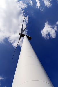 Low angle view of windmill against sky