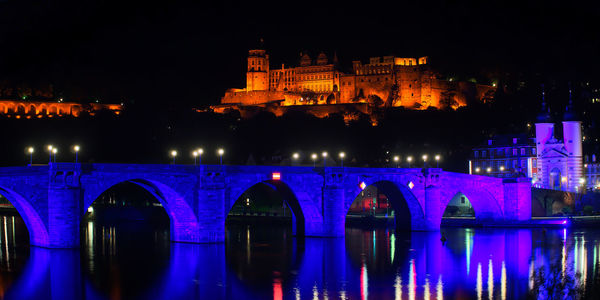 Reflection of illuminated buildings in water