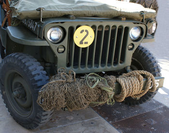 Close-up of rope tied up on road