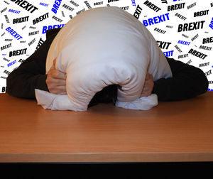 Midsection of man sleeping on table