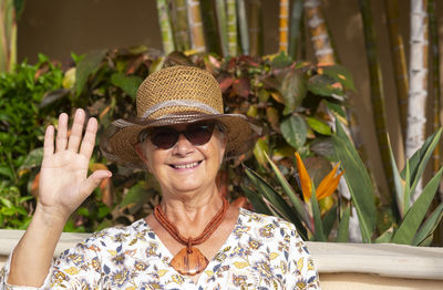 Portrait of smiling senior woman wearing hat