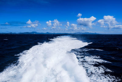 Scenic view of sea against blue sky