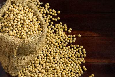 Close-up of grains in sack on table