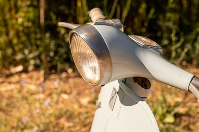 Close-up of hat on field during sunny day