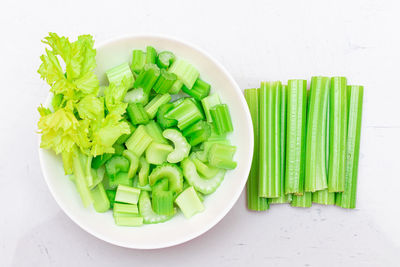 High angle view of chopped vegetables in bowl on table