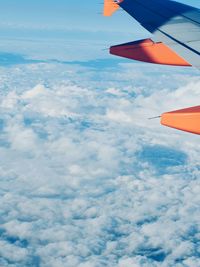 Cropped image of airplane against sky