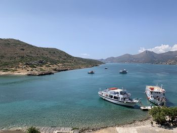 High angle view of sea and bay against clear sky