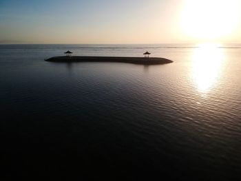 Scenic view of sea against clear sky during sunset