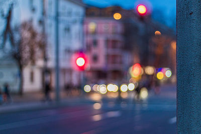 Defocused image of illuminated city street at night