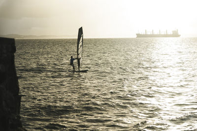 Sail boat sailing on the beautiful beach of ribeira on a sunny day.