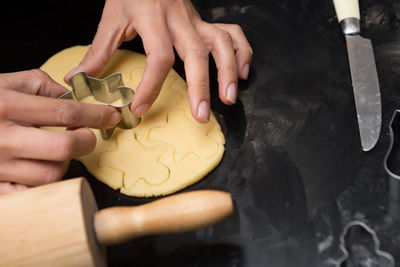 Midsection of person holding cookies