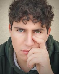 Close-up portrait of a serious young man