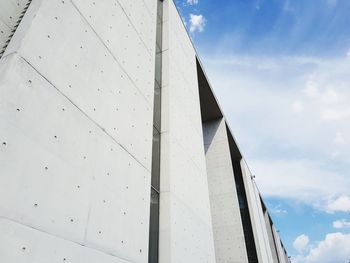 Low angle view of bridge and building against sky