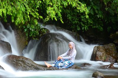 Scenic view of waterfall in forest