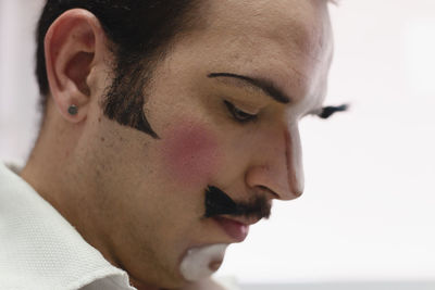 Actor representing a character on the stage of a theater. 